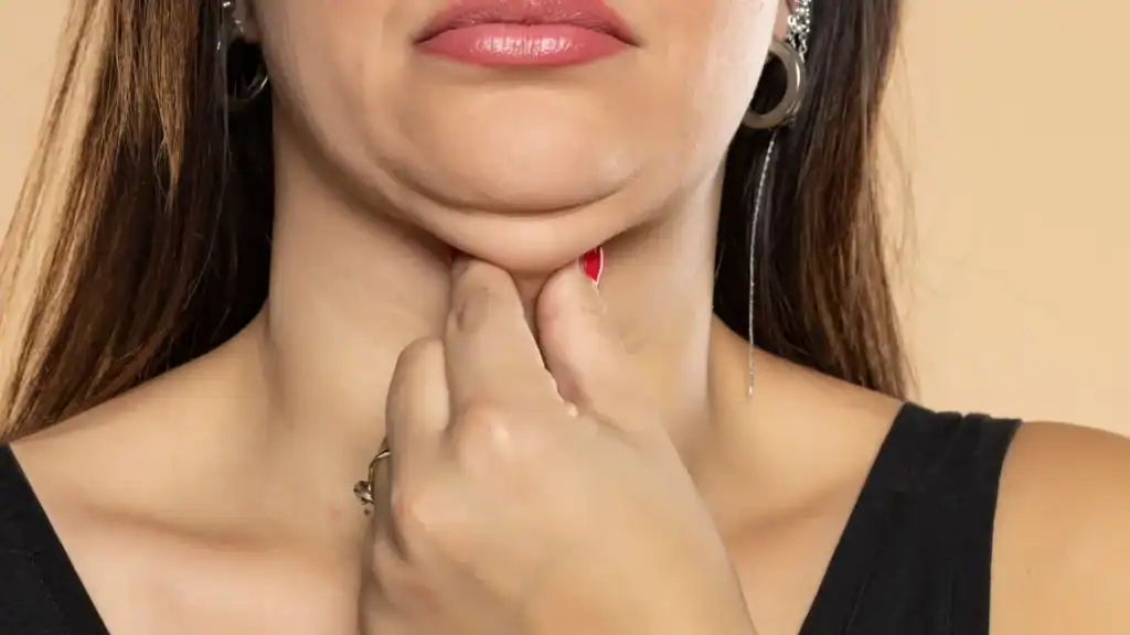 An image of a woman with double chin, sad, worried : Non Surgical Double Chin Removal Treatment in Southend, UK